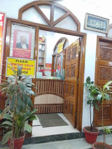 NeoDent Dental Hospital Mehdipatnam exterior — the entrance doorway and registration counter
