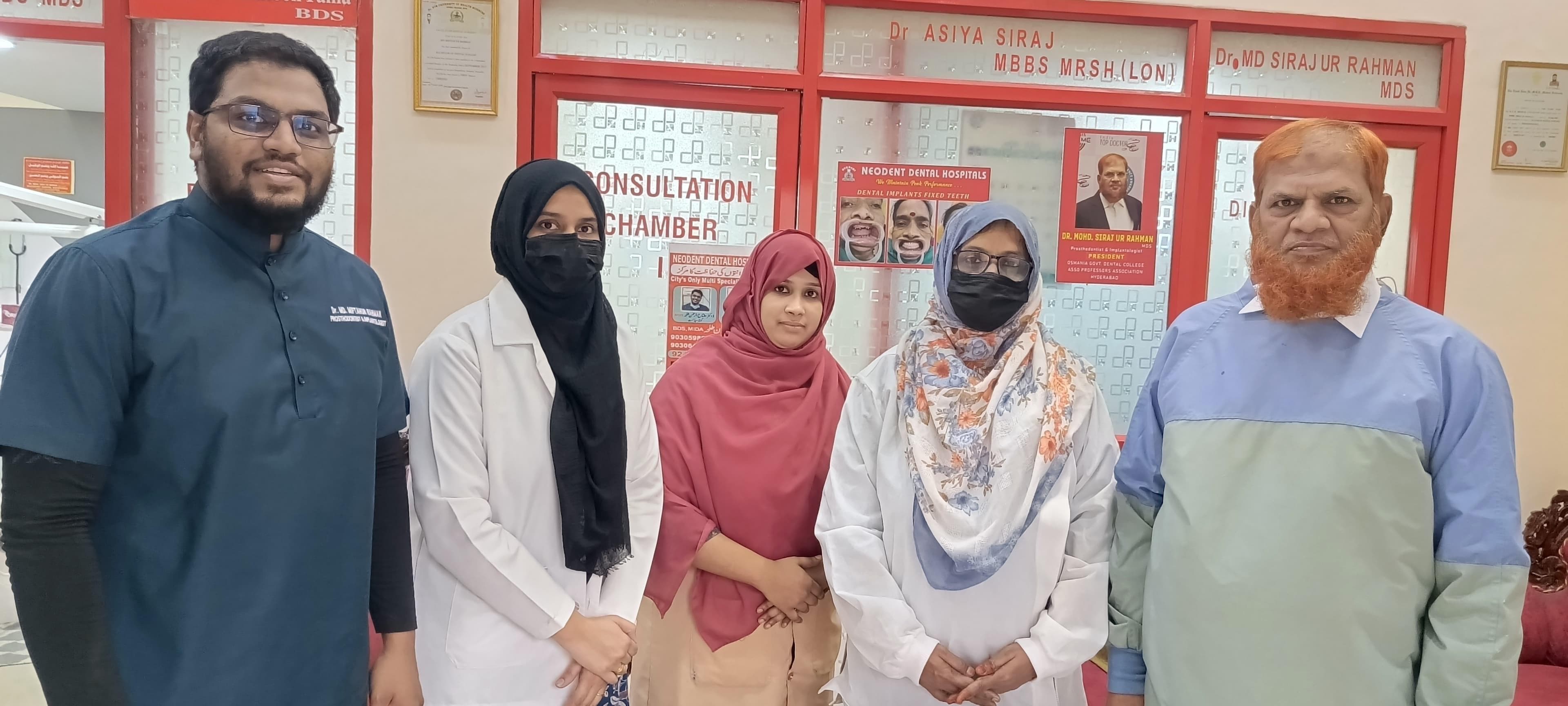Neodent clinicians and team members gathered inside the hospital