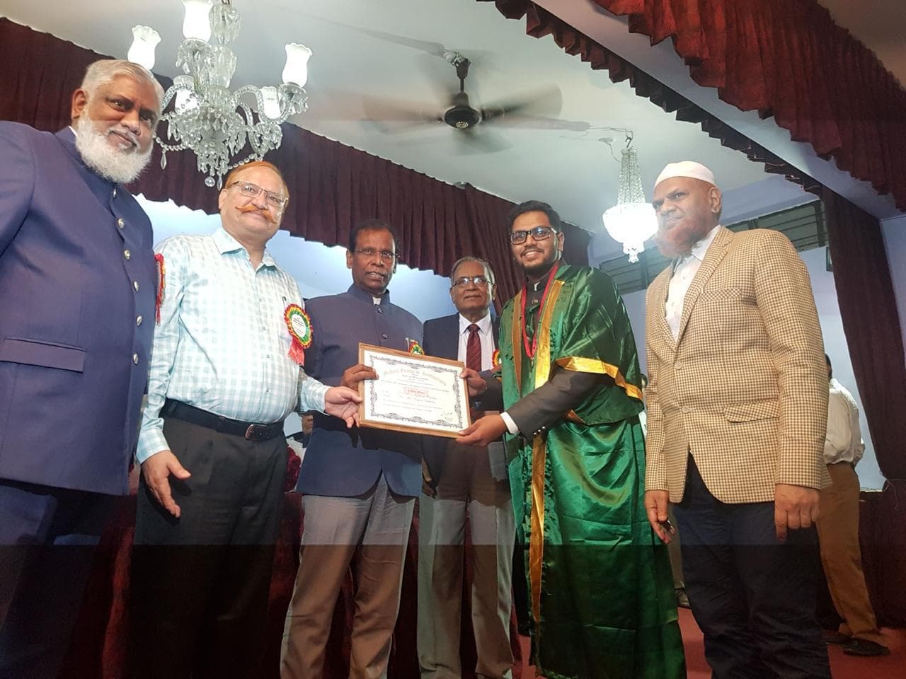 Dr. Md. Miftah Ur Rahman receiving a certificate at a professional ceremony